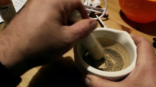 Grinding Spices with Mortar and Pestle Close Up