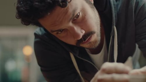 Artist Shaping Clay in Studio