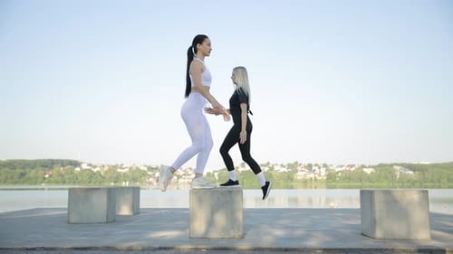 Young Positive Lady Trainer During Fitness Training Outdoors in Park A Women Perform Fitness