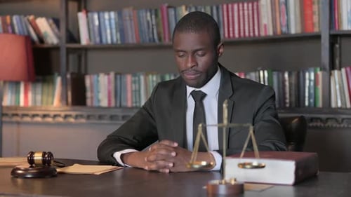Pensive African American Lawyer in Office