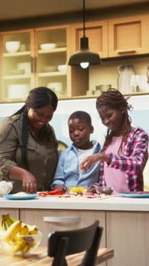 Family Cooking Together in Kitchen, Taking Smartphone Selfie