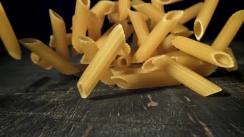 Dry Pasta Falls on the Table Filmed on a Highspeed Camera at 1000 Fps