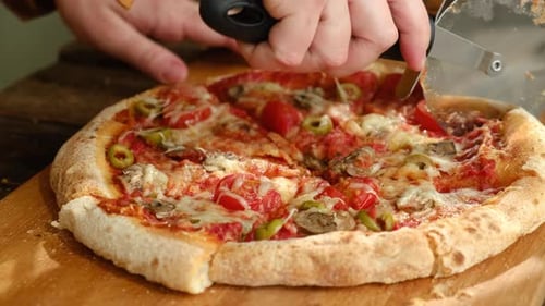 Fresh Pizza Cut with Pizza Cutter Close Up
