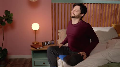 Unwell Man Suffering From Headache Massaging Temples After Waking Up