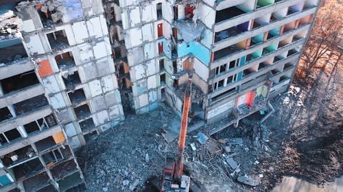 Special machinery destroys old buildings. Destruction of a building with special machine