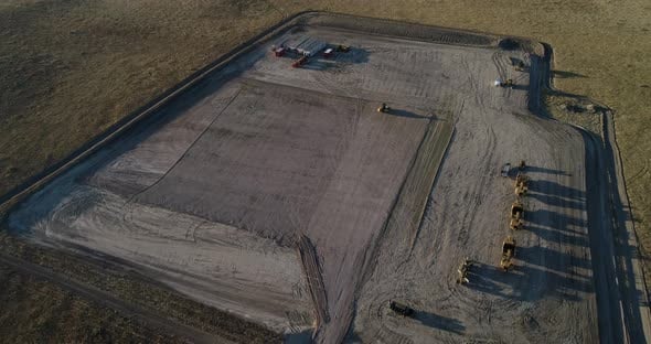 High altitude downshot over a mostly empty fracking pad during the late ...
