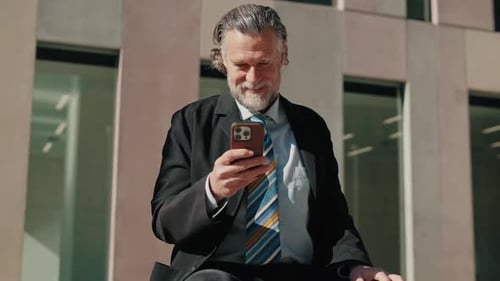 Adult Using Smartphone in Urban Setting