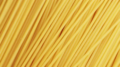 Italian Spaghetti or Noodle Macaroni Pasta Raw Food Background or Texture Close Up