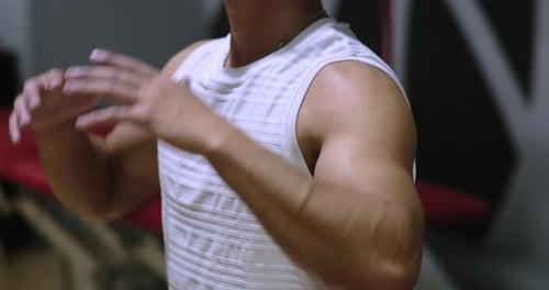 Unrecognizable Young Man Training at Gym Confident Bodybuilder Working Out with Weights in Sport