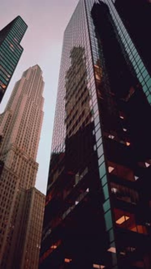 Modern City Skyscrapers Vertical Pan Up at Dusk