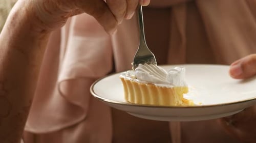 Women Eating Cheese Cake Close Up