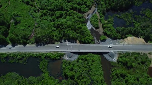 Top View of Cars Drive Along Road in Countryside in Summer Irrl