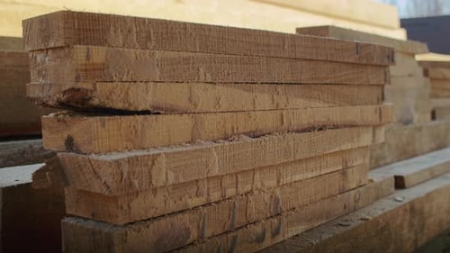 Stacked Lumber Showing Raw Texture of Freshly Cut Wood