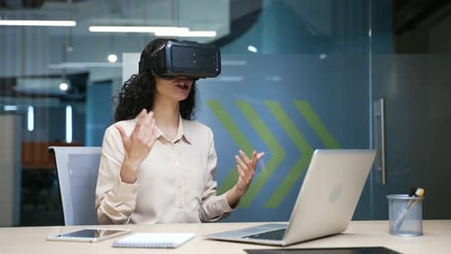 Woman Using VR Headset in Modern Office