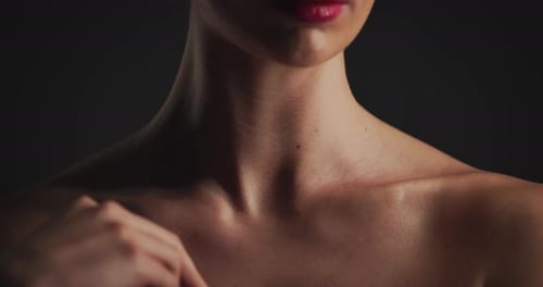 Hand, shoulder and woman in studio for skincare, dermatology and self care