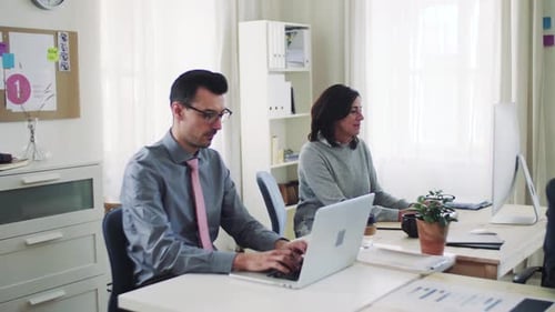 Diverse team of business professionals collaborating in a modern office space