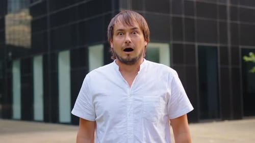 Surprised Man with Open Mouth Outdoors