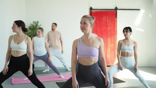 Yoga Class Pilates Workout Group of Sporty People Doing Exercise in Studio Class for Yoga Wellness