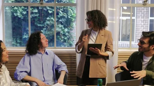 Business Team Meeting Around Conference Table in Office