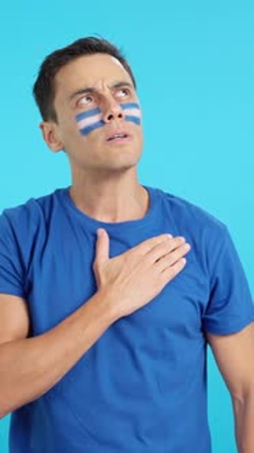 Man Listening to the El Salvador National Anthem with Solemnity