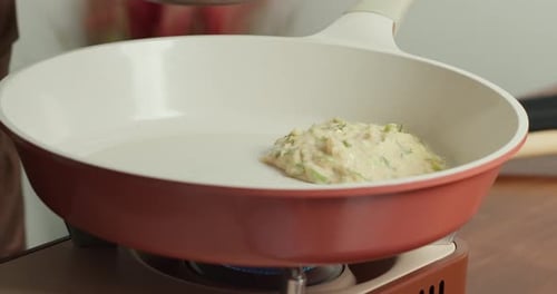 Making Pancakes From Grated Zucchini Closeup of Zucchini Fritters Frying in Hot Oil Showcasing a