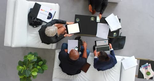 Team Working Around Table in Office Space