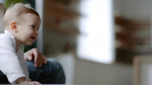 Baby Crawling and Smiling Indoors During Daytime