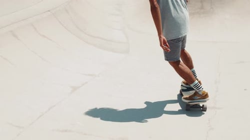 Professional Skater in Bowl Skatepark Doing Tricks Skateboarder Carving a Turn in a Deep Concrete