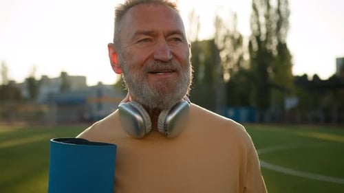 Elderly Happy Caucasian European Pensioner Man Walk Stadium City Outside Smiling Training Physical