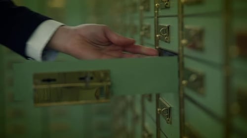 Sales Team Having a Serious Matter of Conversation Inside the Vault Room