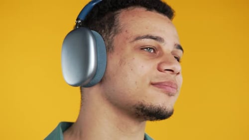 Young Adult Listening to Music on Headphones