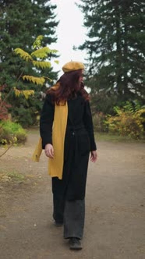 Tourist in Vibrant Garden Smiling in Yellow Beret and Scarf