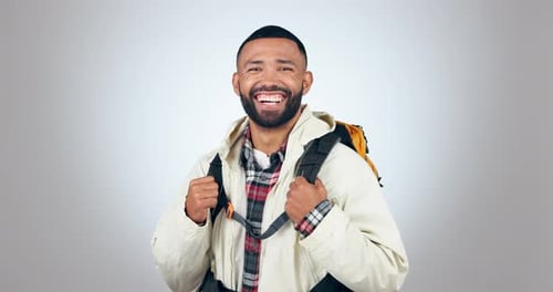 Hiking, backpack and face of man in studio excited for to explore on adventure, journey and holiday
