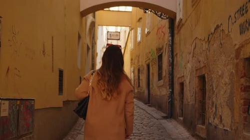 Beatiful Woman Tourist Walking In An Old European Street, Slow Motion