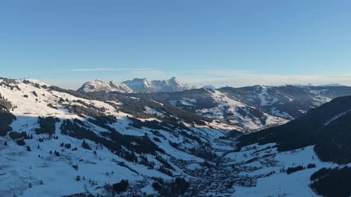Winter Aerial Landscape of Saalbach Village in Snowy Alps in Austria with Clear Blue Sky on a Sunny