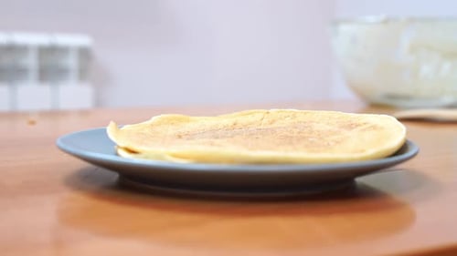 Pancakes Being Stacked On A Plate