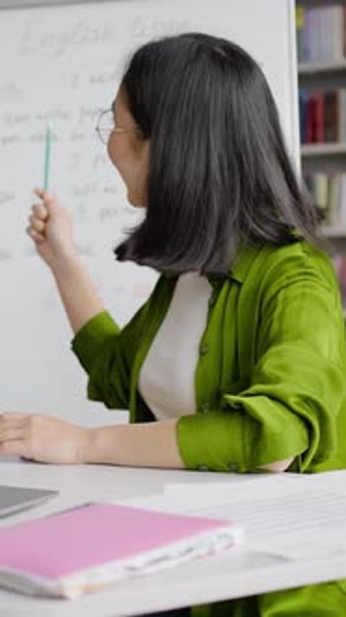 Enthusiastic Woman Teaching English Online with Whiteboard