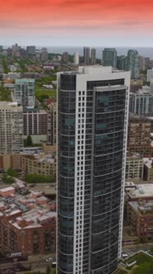Scenery of beautiful Chicago with diverse buildings. Cars crossing bridges over the river.