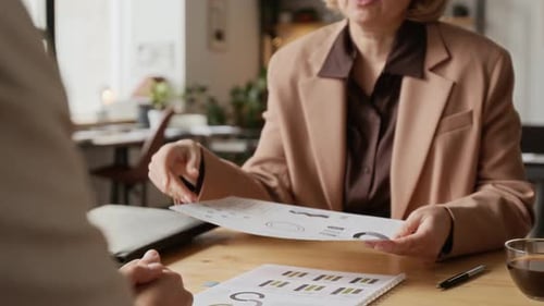 Two Unrecognizable Women Making Business Deal and Shaking Hands in Modern Office
