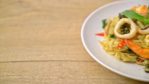stir fried spicy noodles with sea food (Pad Cha Talay) - Thai food style