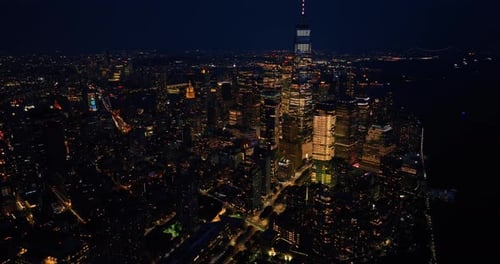 Impressive night scenery of New York. Drone descending above the vibrant city.