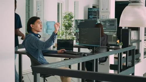 Asian Web Developer Working with Hologram and Augmented Reality