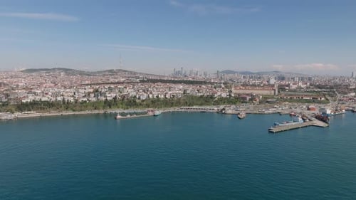 Aerial Panoramic View of Sea Coast and Metropolis with Modern High Rise Office Towers in Distance