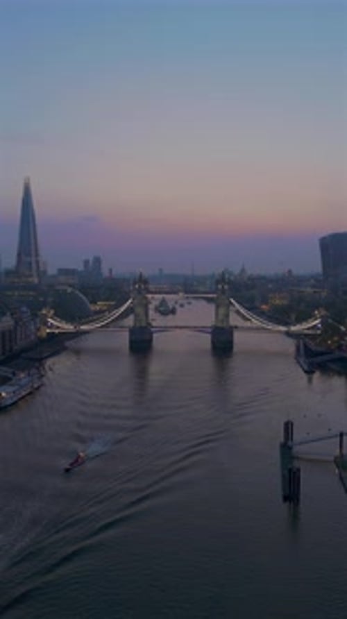 This Aerial Twilight View Captures Tower Bridge and the Iconic London Skyline Beautifully