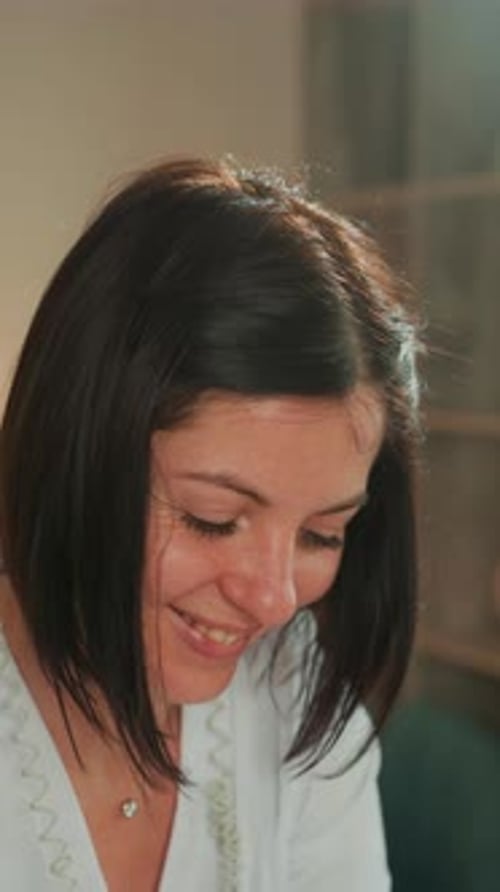 Esthetician Applying Soothing Microcurrent Facial with Warm Lighting Relaxed Woman in Spa Setting