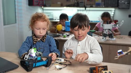 Elementary Students Assembling Robotics at School