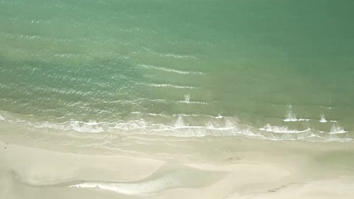 Aerial birds eye view down shot of pristine tropical beach in Thailand