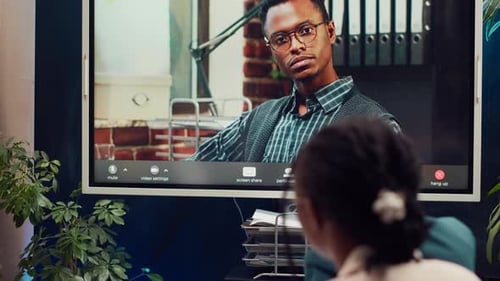Management Team Meeting with CEO on Videocall Connection in a Boardroom