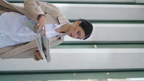 Businesswoman Walking Reading Newspaper on Street Girl Holding Press Vertically