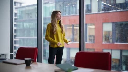 Annoyed Woman Boss Calling Cellphone Complaining on Mistake at Office Window